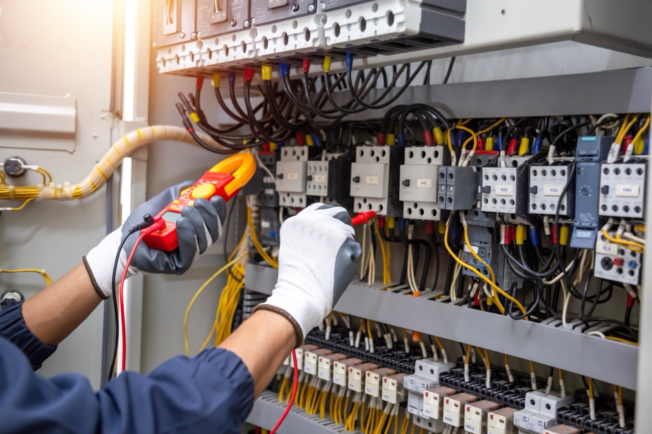 AC voltmeter checking electric current voltage at circuit breaker terminal and cable .